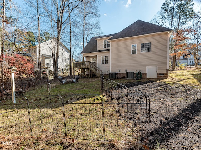 rear view of property with central air condition unit, crawl space, stairway, and a deck