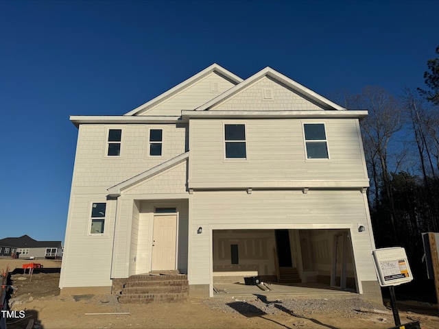 view of front of property with a garage