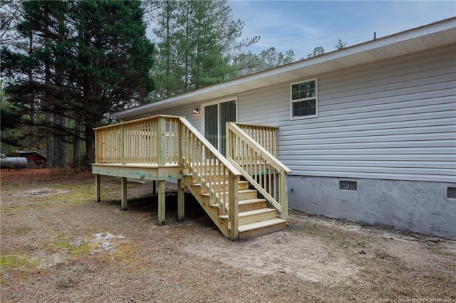 exterior space featuring crawl space and a wooden deck