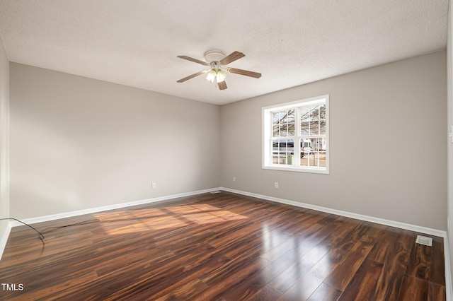 unfurnished room featuring a textured ceiling, ceiling fan, and dark wood-type flooring