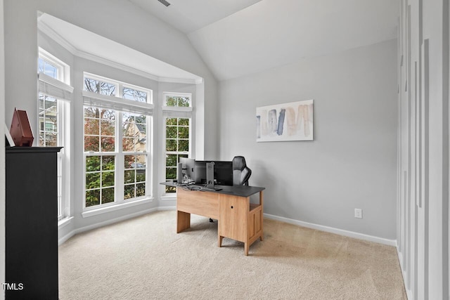 carpeted office featuring vaulted ceiling and ornamental molding