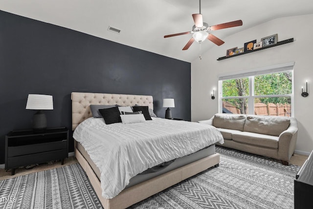 bedroom with carpet flooring, ceiling fan, and lofted ceiling