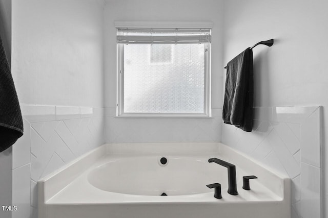 bathroom with a washtub