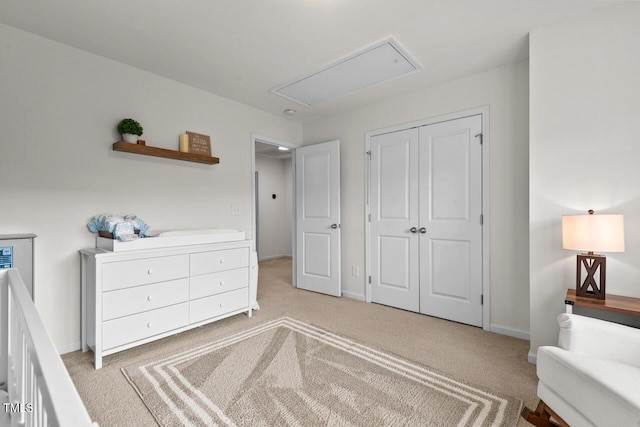 bedroom featuring light carpet and a closet