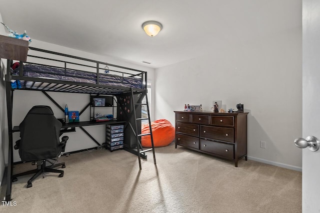 bedroom featuring light colored carpet