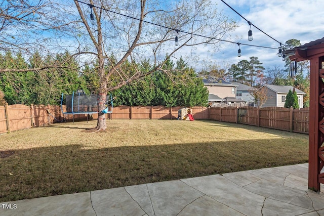 view of yard with a trampoline