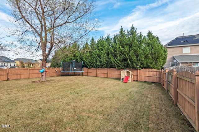 view of yard with a trampoline