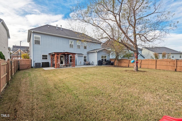 back of property with a lawn, a patio area, and central air condition unit