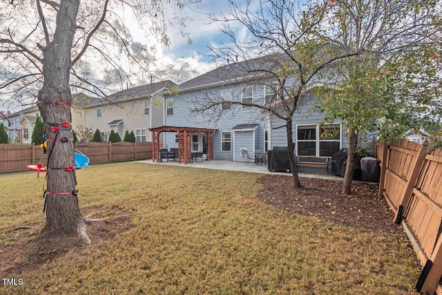 back of property featuring a yard and a patio