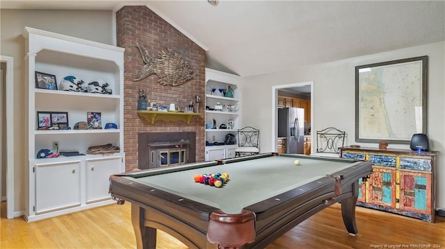 playroom with light hardwood / wood-style floors, vaulted ceiling, and billiards