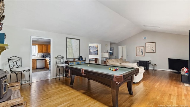 game room featuring vaulted ceiling, light hardwood / wood-style flooring, and pool table