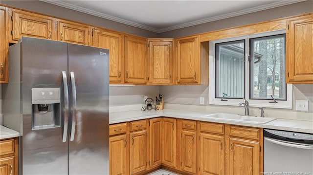 kitchen featuring sink, ornamental molding, and appliances with stainless steel finishes