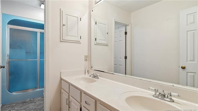 bathroom with vanity and walk in shower