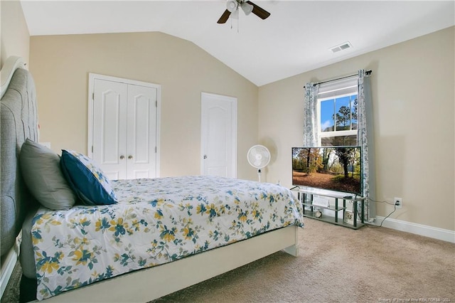 bedroom featuring carpet, a closet, ceiling fan, and lofted ceiling