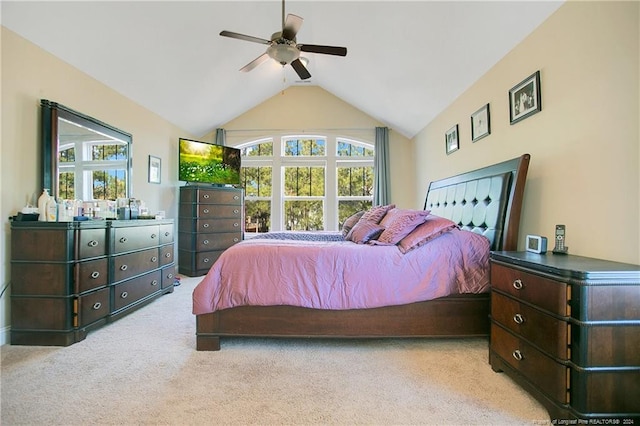 bedroom with ceiling fan, light carpet, and lofted ceiling