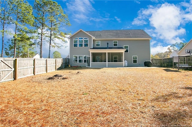 back of house with a sunroom