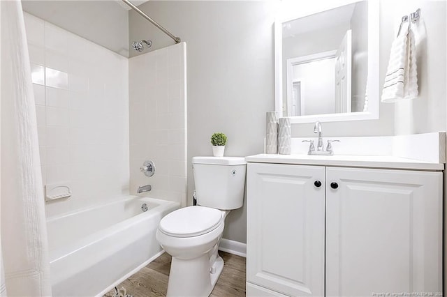 full bathroom featuring vanity, toilet, shower / bathtub combination with curtain, and hardwood / wood-style flooring