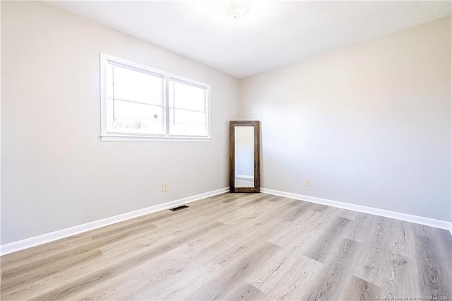 unfurnished room featuring light hardwood / wood-style flooring