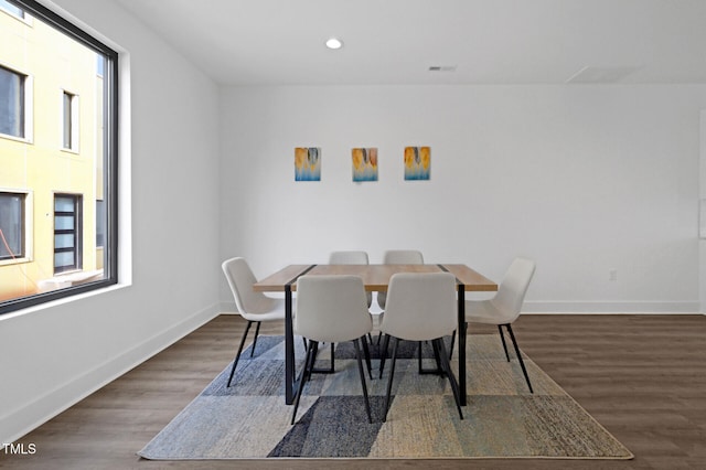 dining space featuring dark hardwood / wood-style flooring