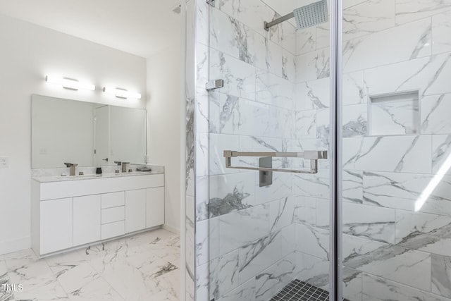 bathroom featuring vanity and an enclosed shower