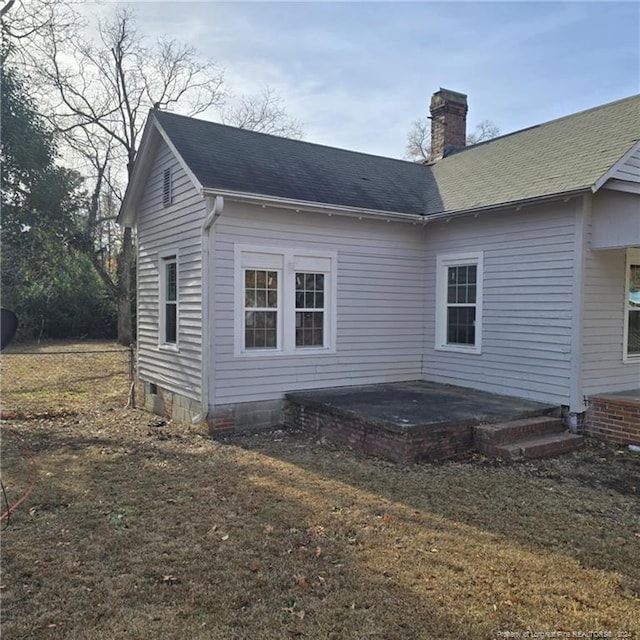 exterior space with a lawn and a patio area