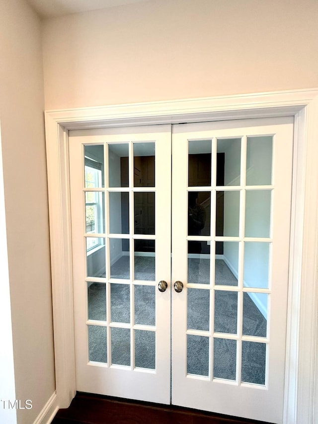 doorway to outside with french doors and dark hardwood / wood-style floors