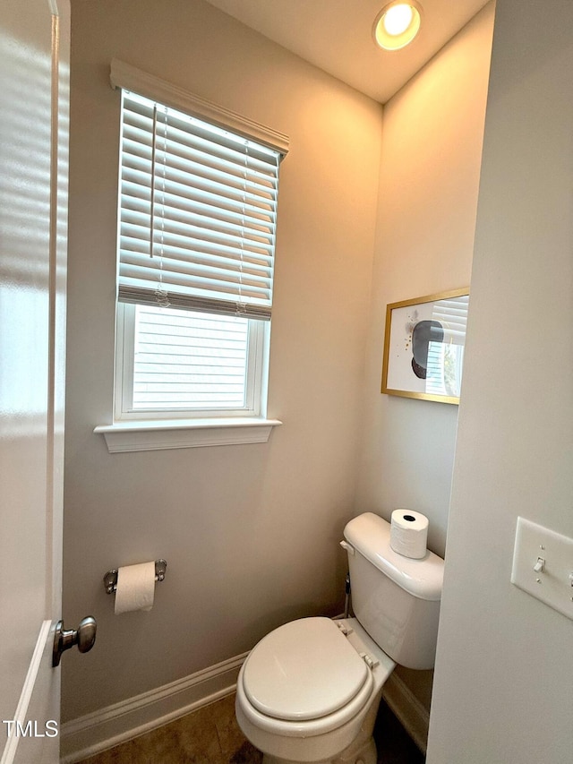 bathroom with tile patterned flooring and toilet