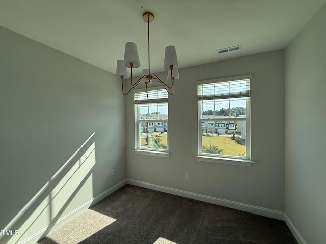 unfurnished dining area featuring dark colored carpet and a notable chandelier