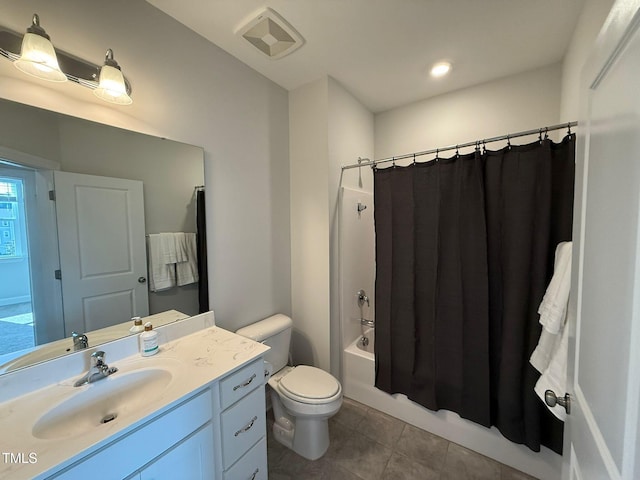 full bathroom featuring tile patterned flooring, shower / bath combo, vanity, and toilet