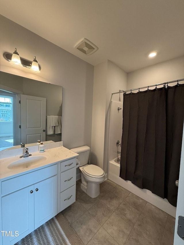 full bathroom with tile patterned floors, vanity, shower / bathtub combination with curtain, and toilet