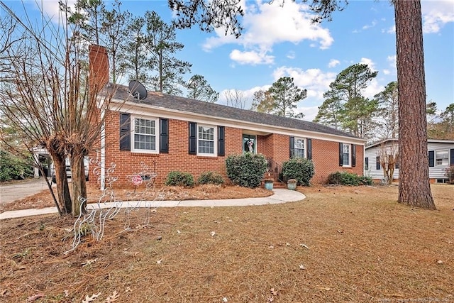 ranch-style home with a front yard