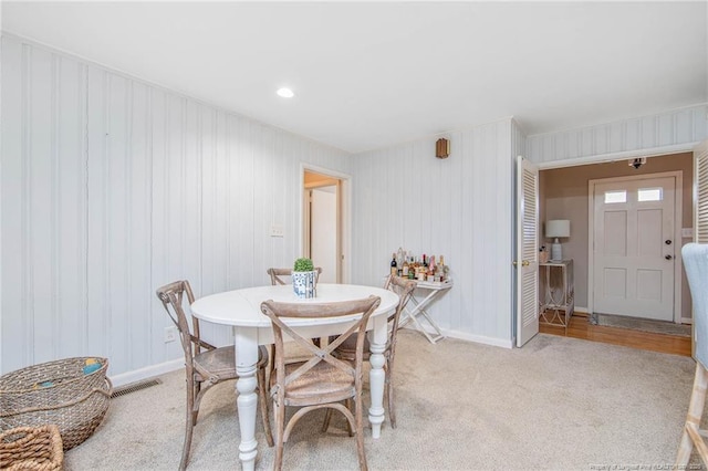 dining area with light carpet