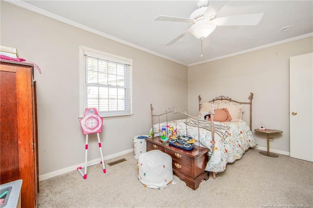 bedroom with crown molding, ceiling fan, and carpet floors