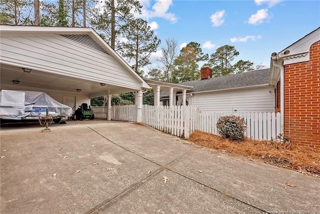 view of home's exterior featuring a carport