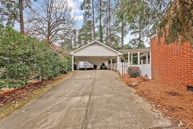 view of side of home with a carport