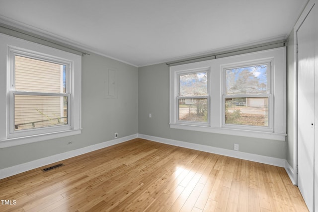 empty room with light wood-type flooring