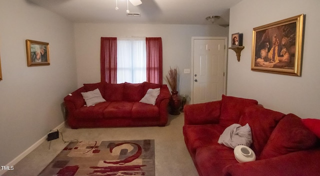 living room with ceiling fan and carpet floors