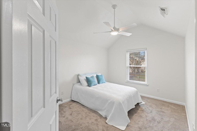 bedroom with visible vents, a ceiling fan, light carpet, vaulted ceiling, and baseboards