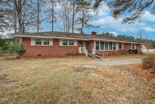 ranch-style home with a front lawn