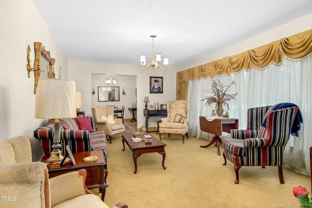 living room with carpet flooring and a chandelier