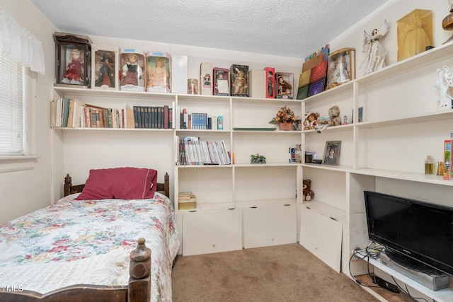 carpeted bedroom with a textured ceiling