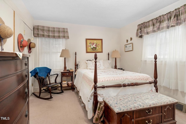 bedroom featuring light colored carpet