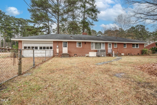 back of house featuring a lawn