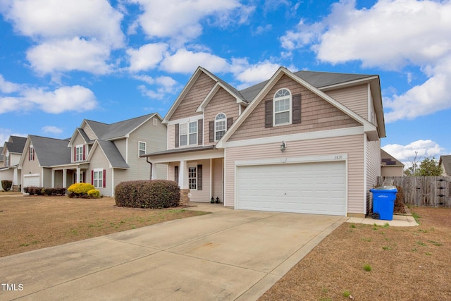 view of front of home featuring a front yard and a garage