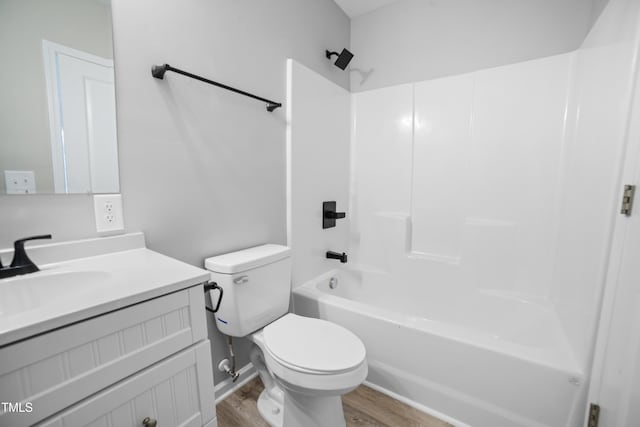 full bathroom featuring toilet, vanity, shower / bath combination, and hardwood / wood-style flooring