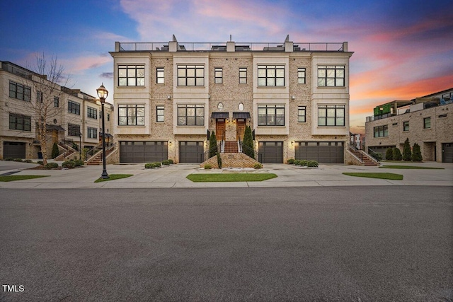 outdoor building at dusk with a garage