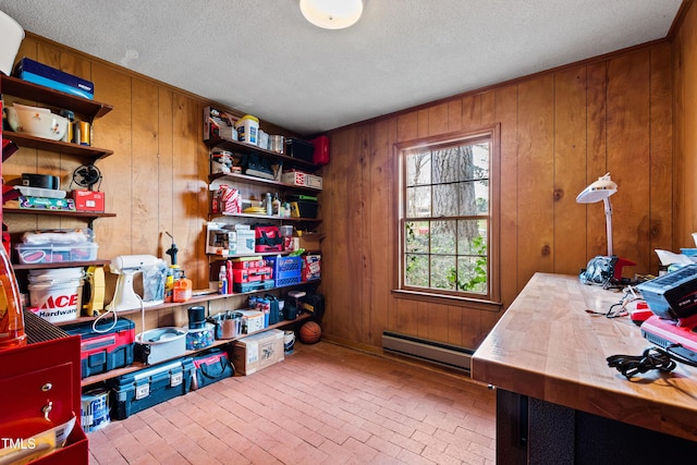 storage room featuring a baseboard heating unit