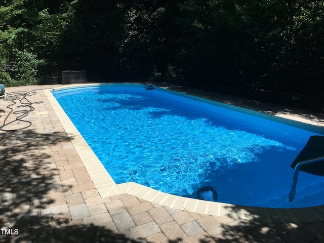 pool featuring a patio