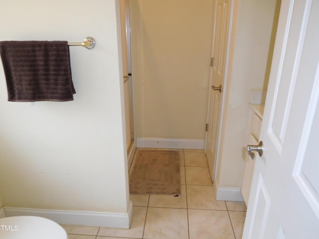 bathroom featuring tile patterned floors and toilet