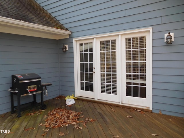 wooden terrace featuring area for grilling